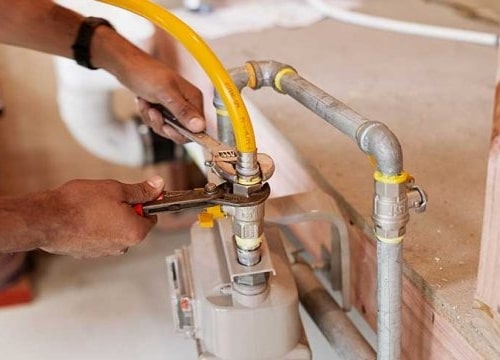 Man fixing a gas line | S&J Plumbing and Gasfitting